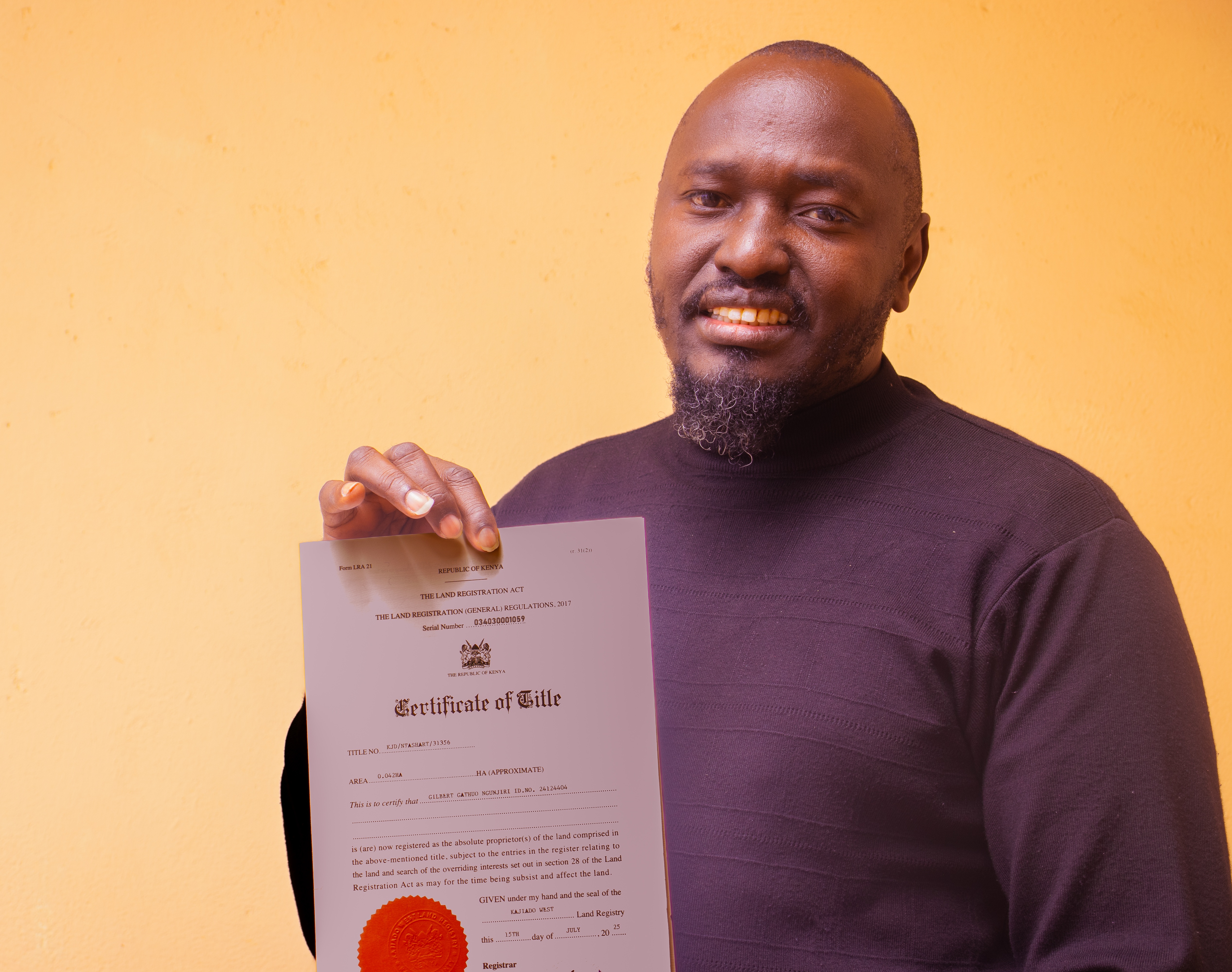 MD,Ms. Jayne Nyokabi handing over Kerobi Plain's title deed