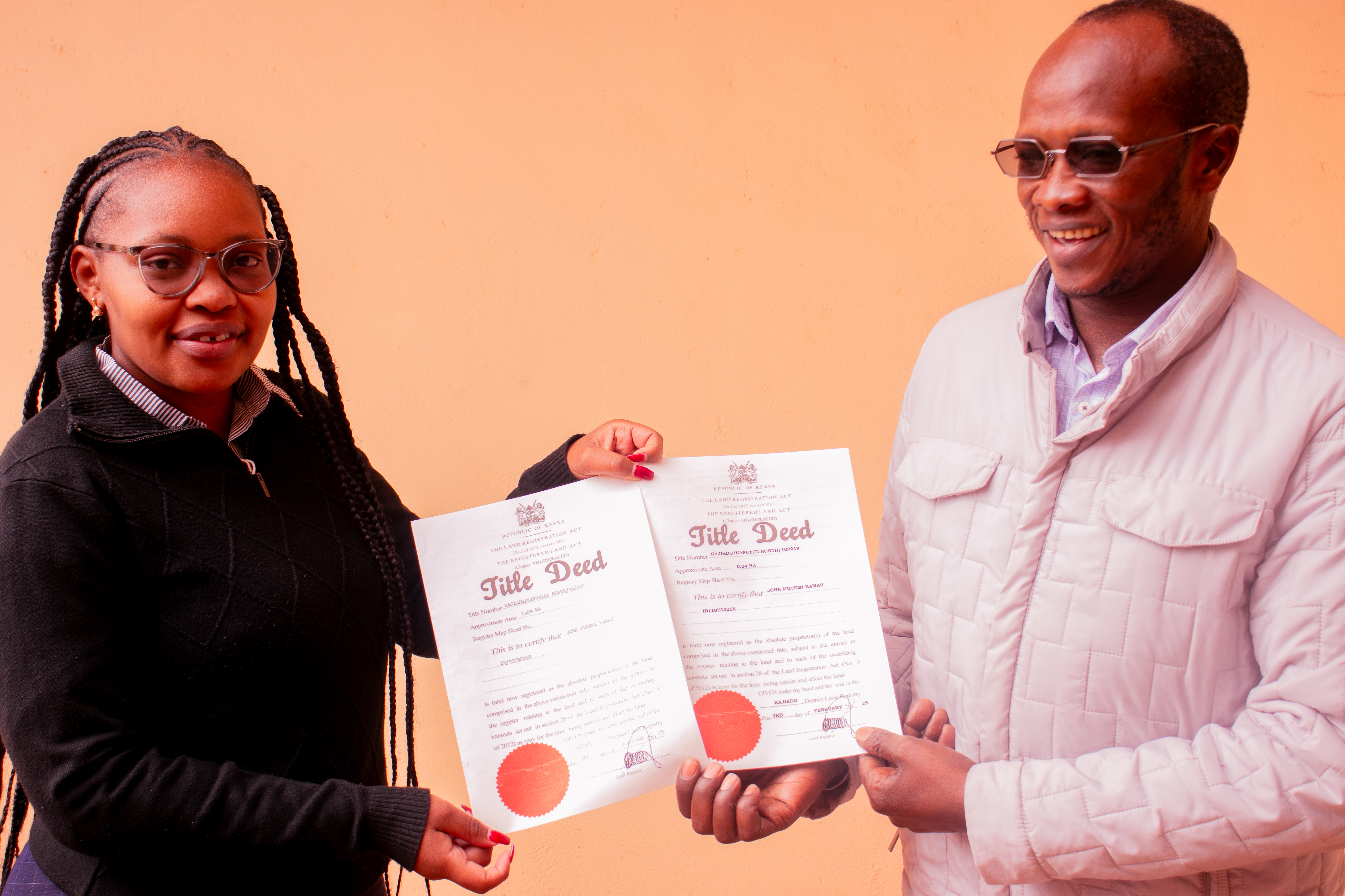 Legal Officer, Ms. Anastasia Kemunto handing over to client